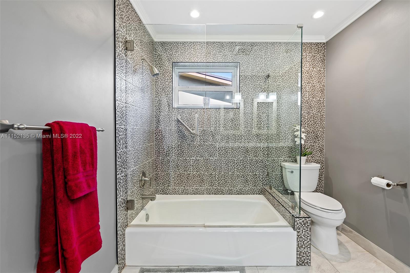 4314 Fillmore Street Hollywood, FL 33021 - Photo 21 of 27 a bathroom with a tub and shower