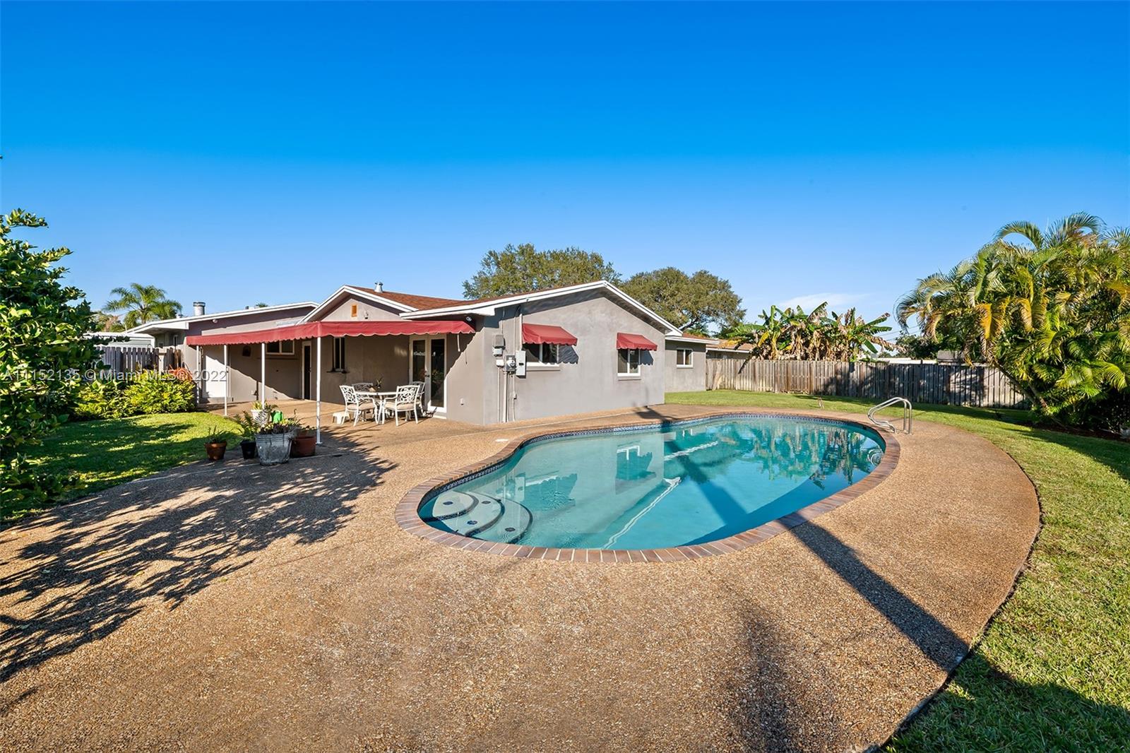 4314 Fillmore Street Hollywood, FL 33021 - Photo 25 of 27 an outdoor space with swimming pool and furniture