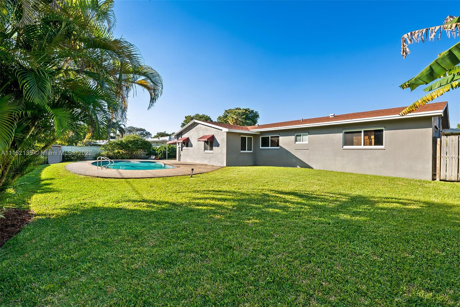 4314 Fillmore Street Hollywood, FL 33021 - Photo 26 of 27 a view of a house with a swimming pool