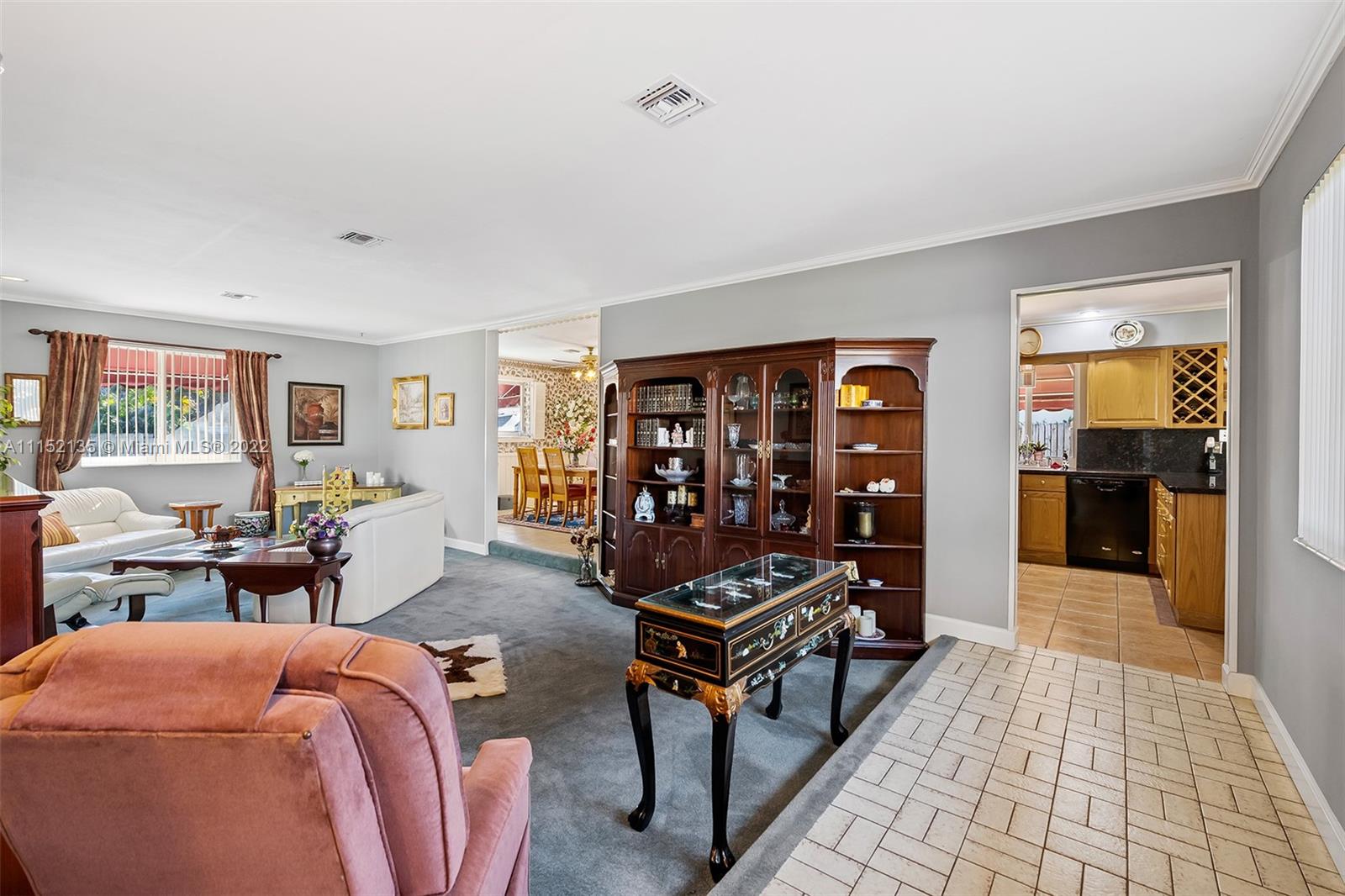 4314 Fillmore Street Hollywood, FL 33021 - Photo 4 of 27 a living room with furniture a table and a window