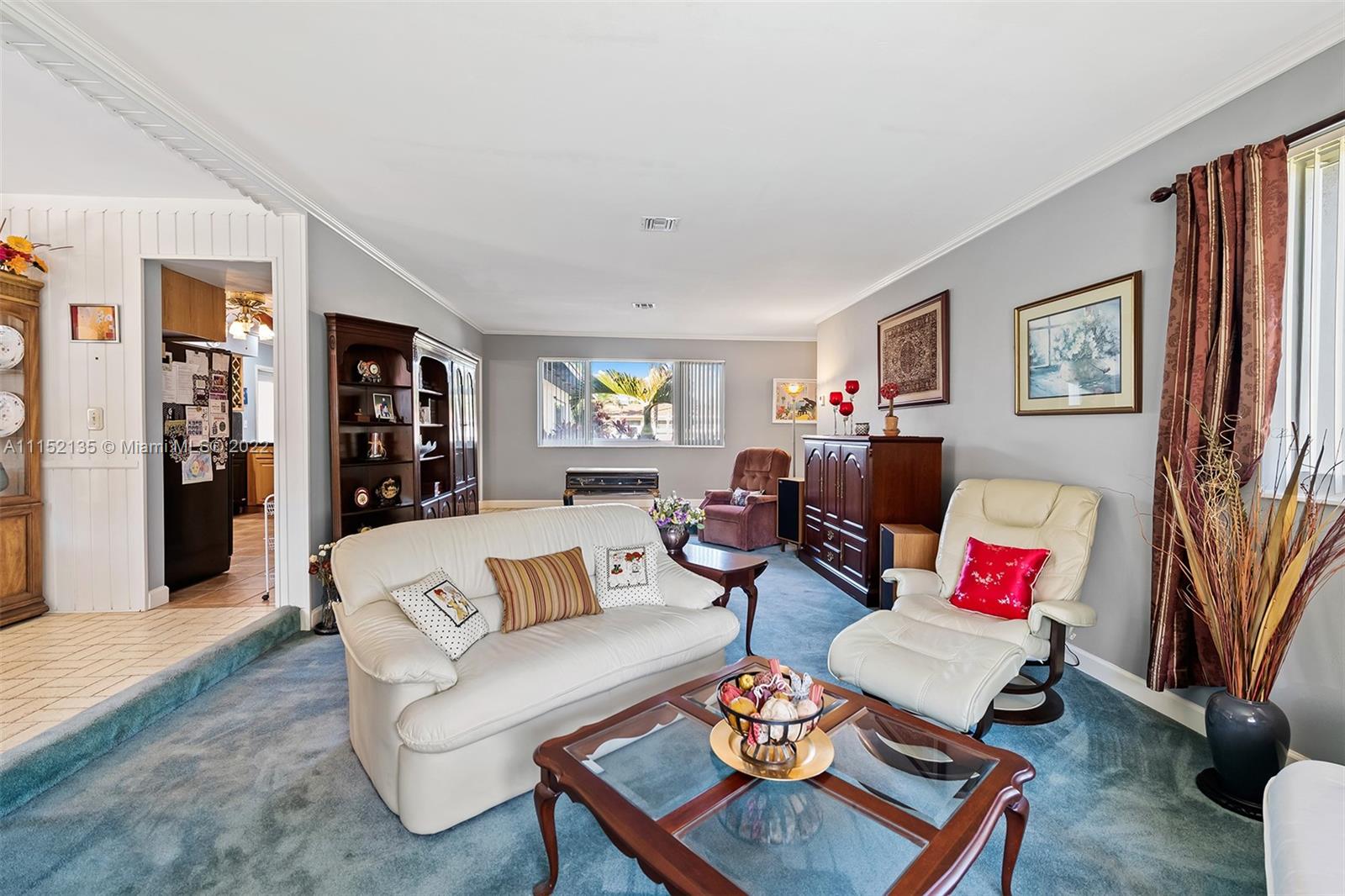 4314 Fillmore Street Hollywood, FL 33021 - Photo 6 of 27 a living room with furniture and a wooden floor