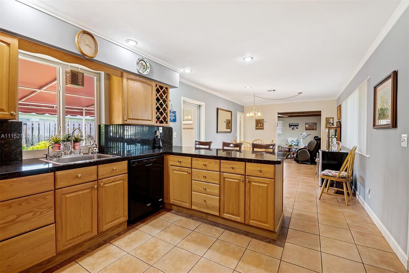 4314 Fillmore Street Hollywood, FL 33021 - Photo 10 of 27 a large kitchen with a large window and counter space