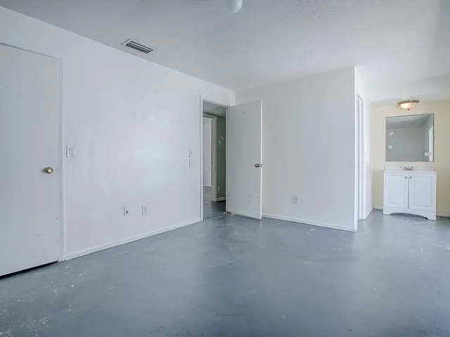 a view of an empty room with a window