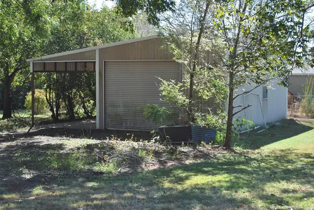 a backyard of a house with lots of green space