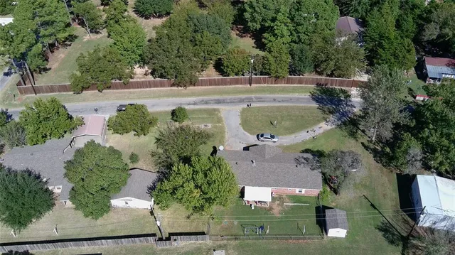 an aerial view of a house with outdoor space