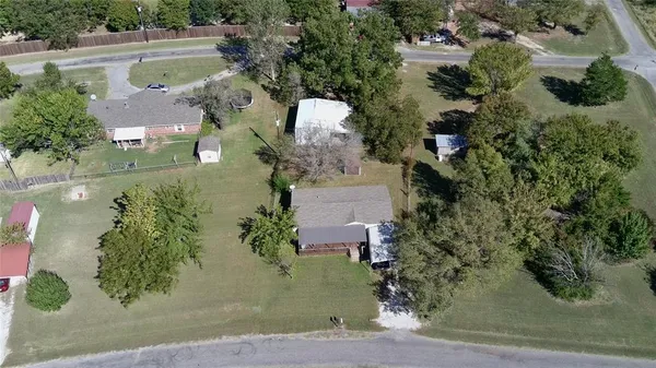 an aerial view of a house with outdoor space