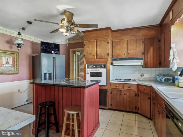 a kitchen with a sink stove and microwave