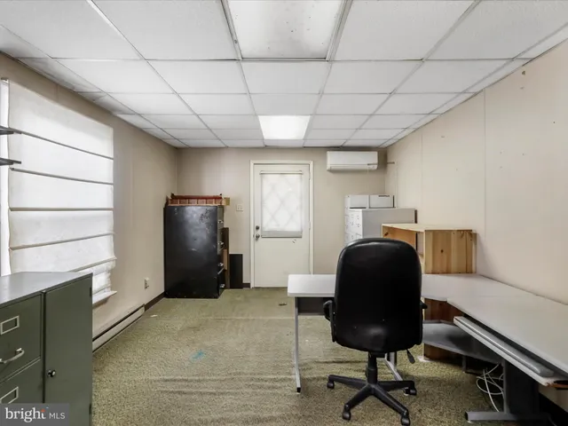 a workspace with furniture and a window