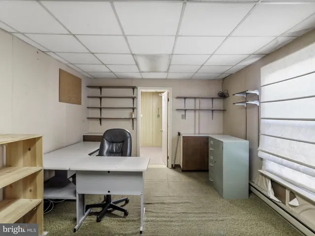 a workspace with furniture and window