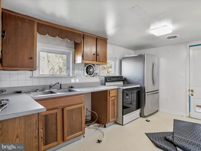 a living room with a couch and a window