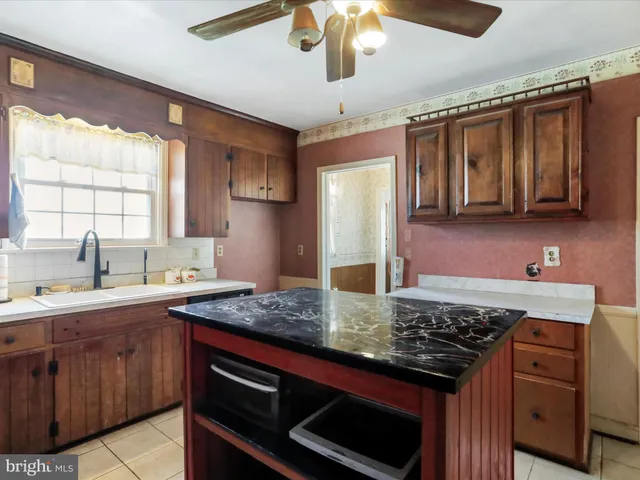 a kitchen with a stove and a sink
