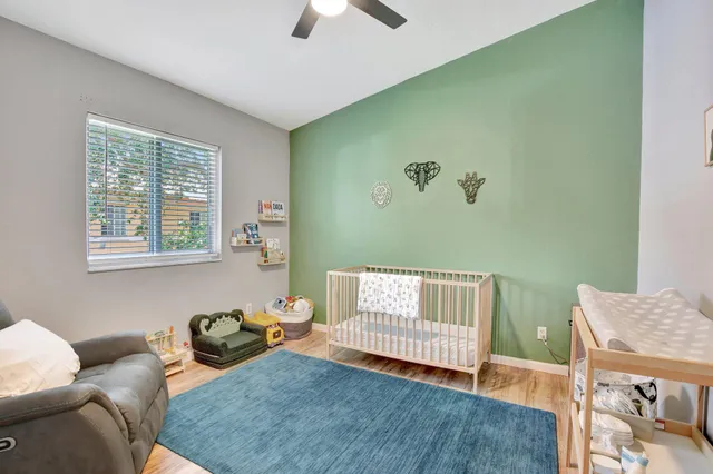 a bedroom with furniture and a window