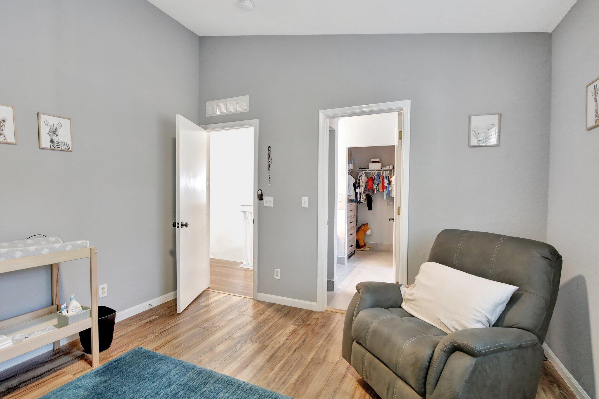 8730 Southwest 21st Street Miramar, FL 33025 - Photo 17 of 45 a living room with furniture and a wooden floor