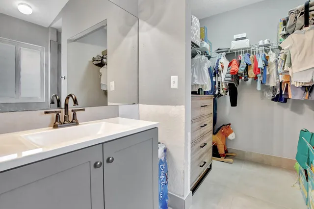 a view of a bathroom sink and a tub