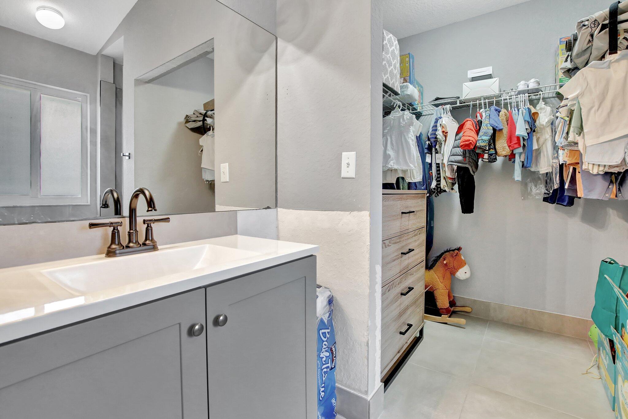 8730 Southwest 21st Street Miramar, FL 33025 - Photo 18 of 45 a view of a bathroom sink and a tub