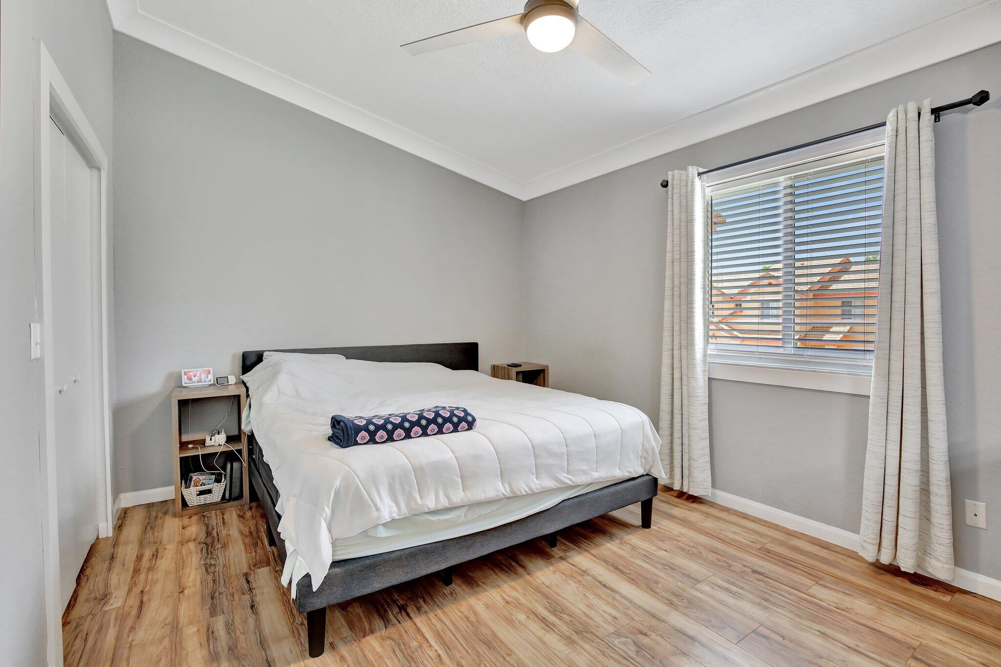 8730 Southwest 21st Street Miramar, FL 33025 - Photo 22 of 45 a bedroom with a bed and a window