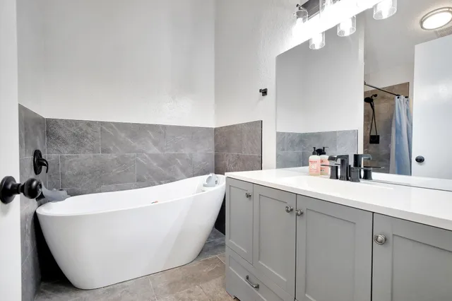 a white bath tub sitting in a bathroom