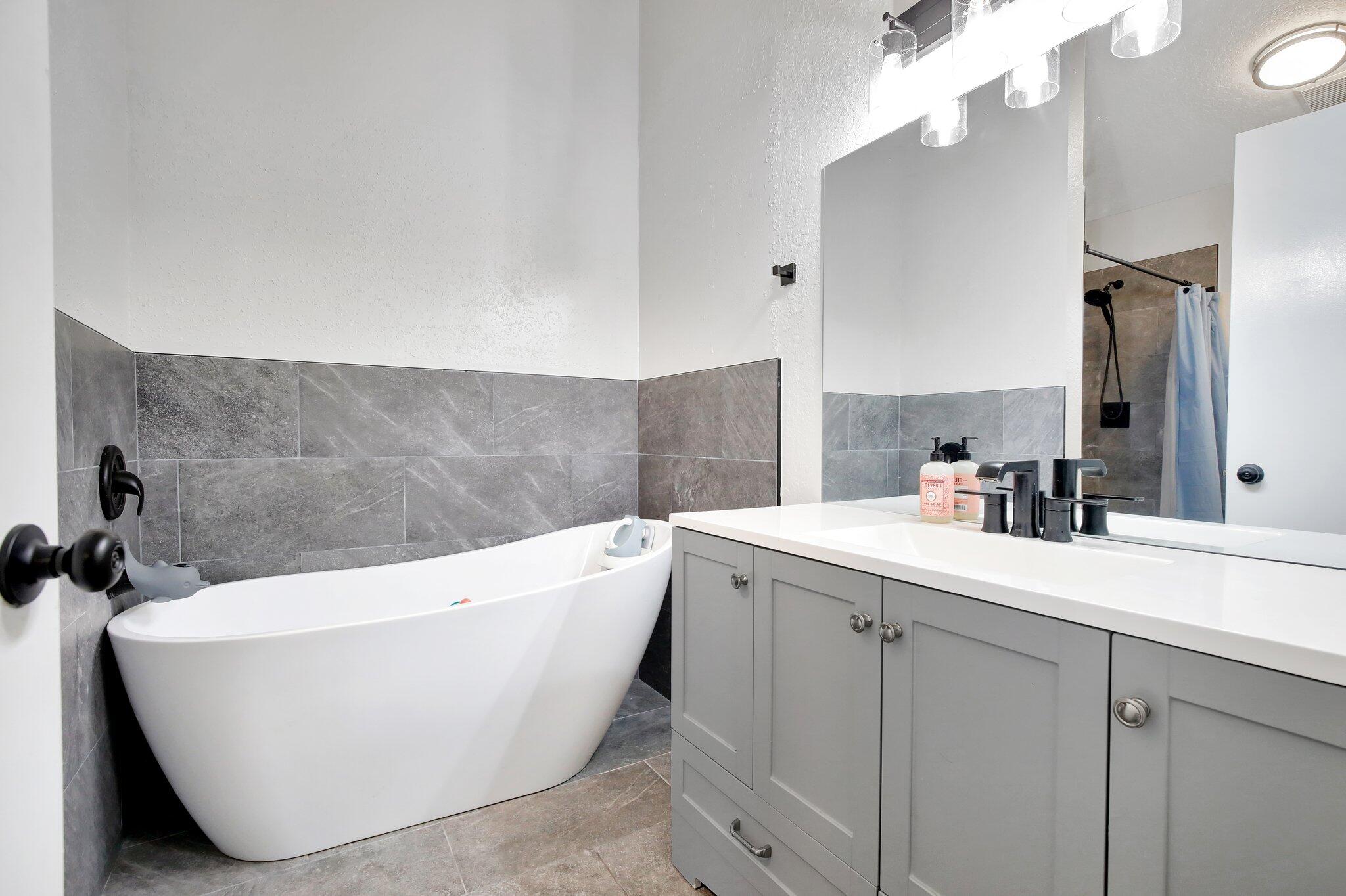 8730 Southwest 21st Street Miramar, FL 33025 - Photo 25 of 45 a white bath tub sitting in a bathroom