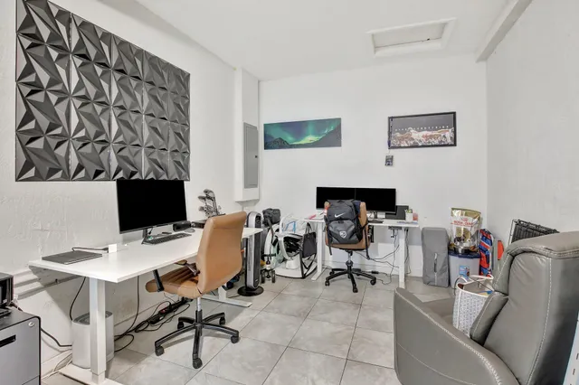 a view of a workspace with furniture and a couch