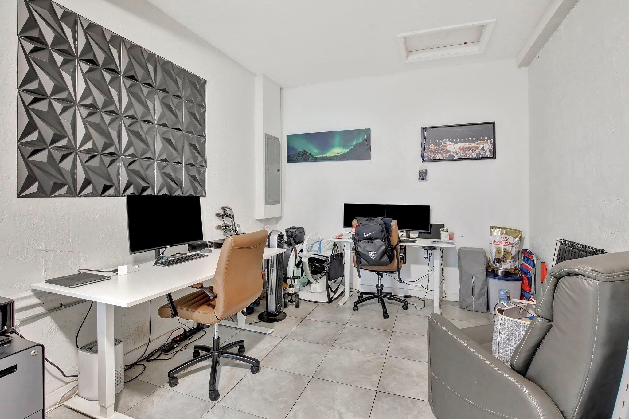 8730 Southwest 21st Street Miramar, FL 33025 - Photo 28 of 45 a view of a workspace with furniture and a couch