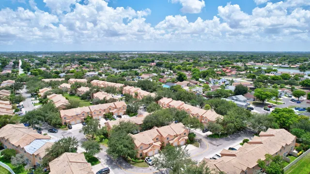 an aerial view of multiple house with yard