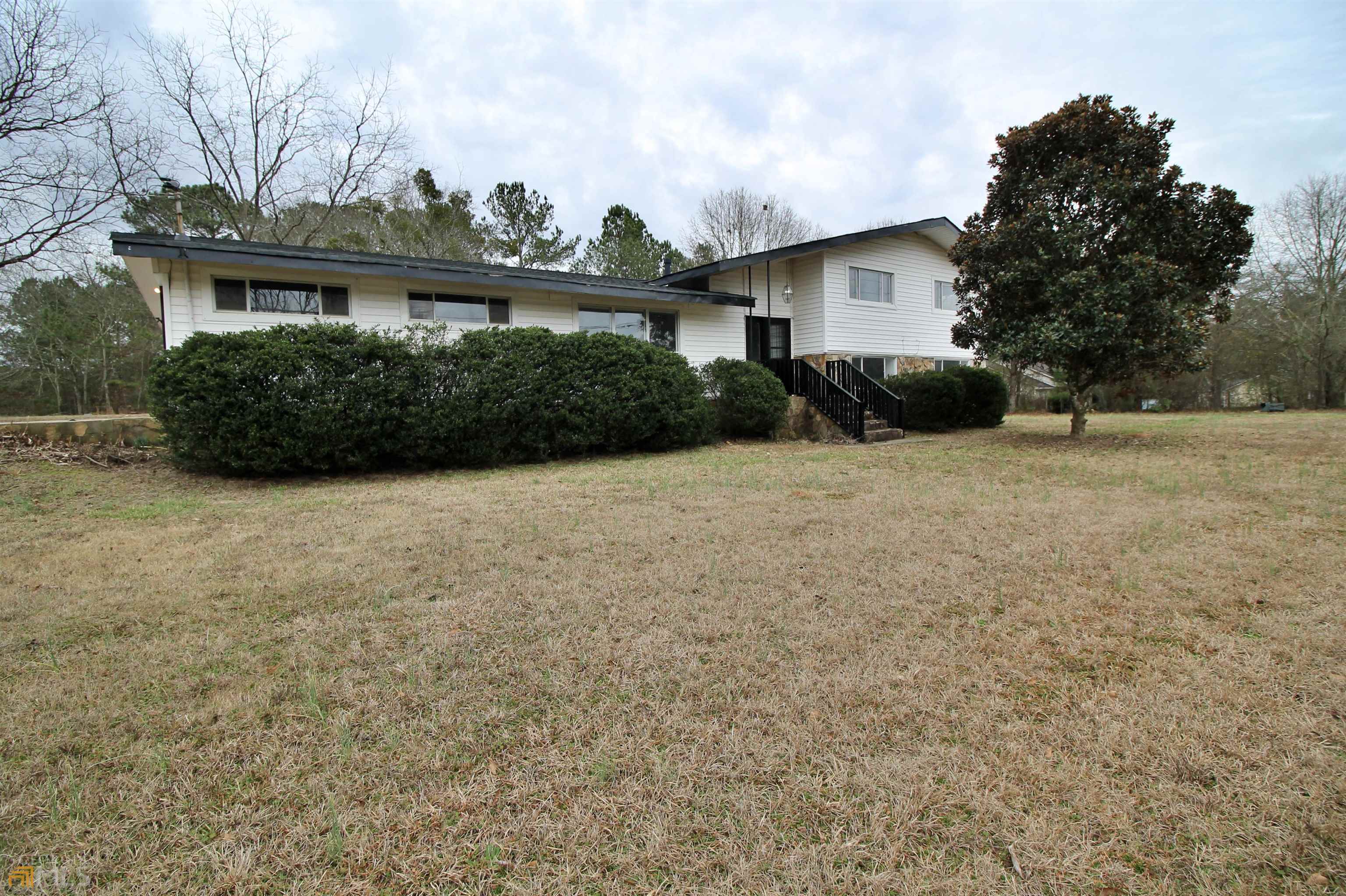 1585 Jackson Lake Road Jackson, GA 30233 - Photo 1 of 1 a view of a house with backyard and garden