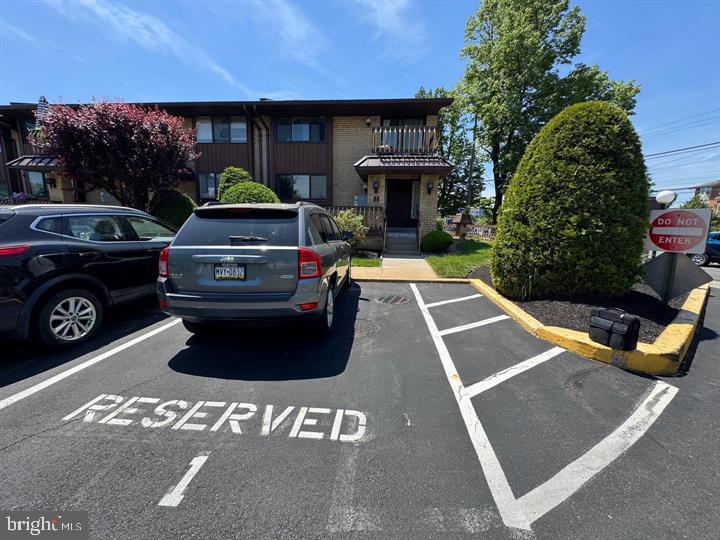 10201-00 Bustleton Avenue, Unit A1 Philadelphia, PA 19116 - Photo 14 of 16 a view of a yard with cars