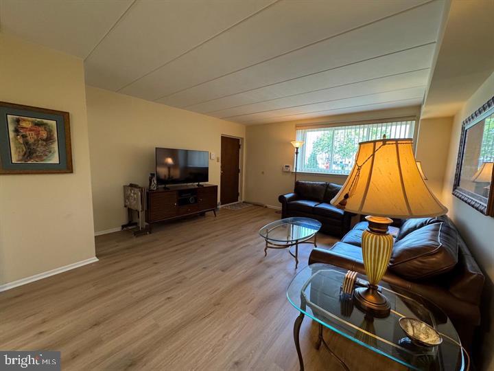 10201-00 Bustleton Avenue, Unit A1 Philadelphia, PA 19116 - Photo 4 of 16 a room with wooden floor and furniture