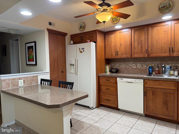 10201-00 Bustleton Avenue, Unit A1 Philadelphia, PA 19116 - Photo 5 of 16 a kitchen with stainless steel appliances granite countertop a sink and a refrigerator