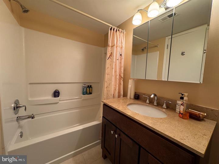 10201-00 Bustleton Avenue, Unit A1 Philadelphia, PA 19116 - Photo 6 of 16 a bathroom with a sink and a mirror