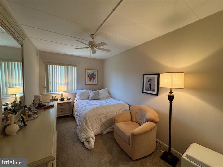 10201-00 Bustleton Avenue, Unit A1 Philadelphia, PA 19116 - Photo 9 of 16 a bedroom with a bed couch and window