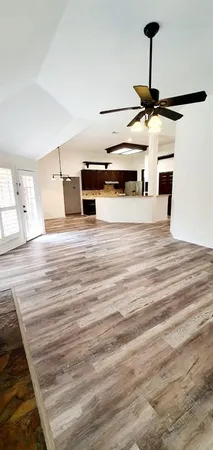 a kitchen with kitchen island sink and stove