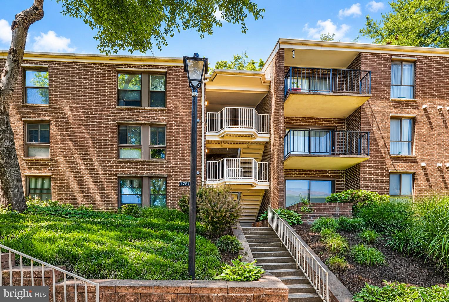 Charming brick apartment complex exterior.