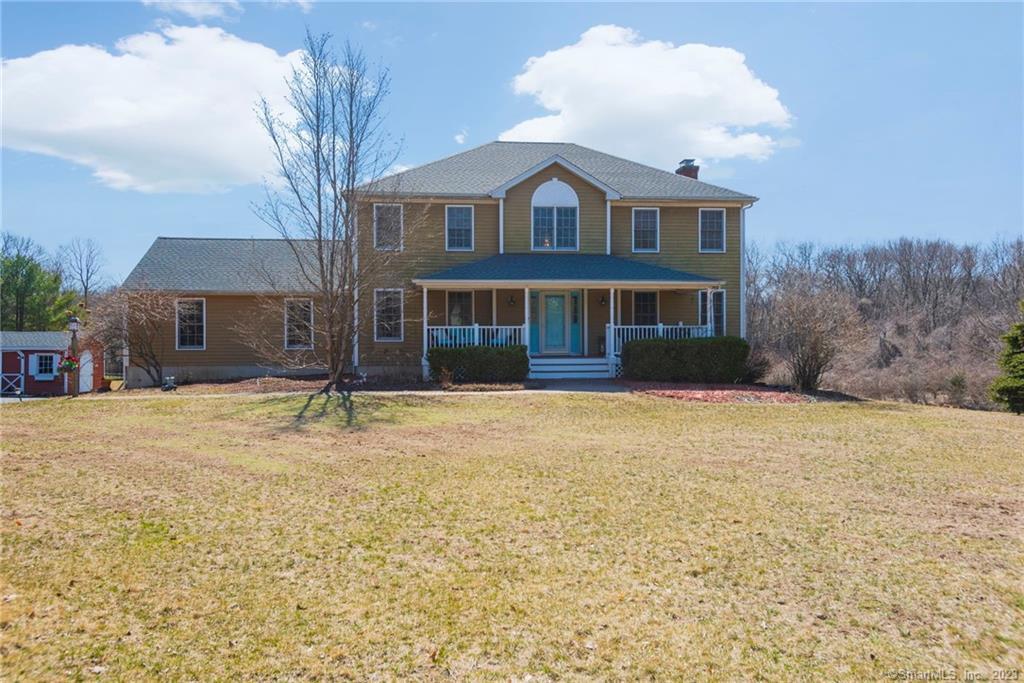 47 Mt Nebo Road Newtown, CT 06470 - Photo 1 of 1 a front view of a house with a yard and garage