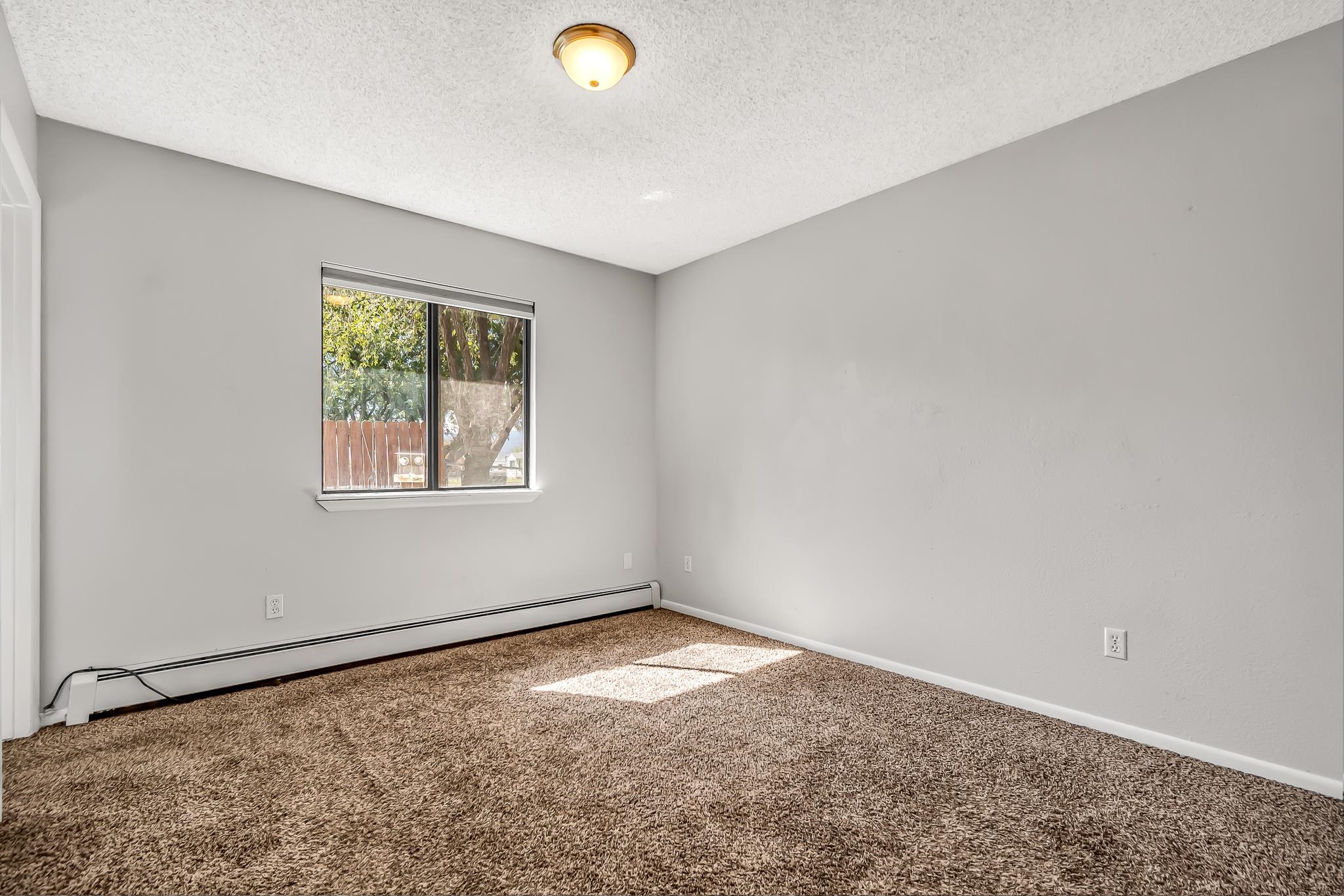 486 Harris Road Grand Junction, CO 81501 - Photo 12 of 15 an empty room with a empty space and window