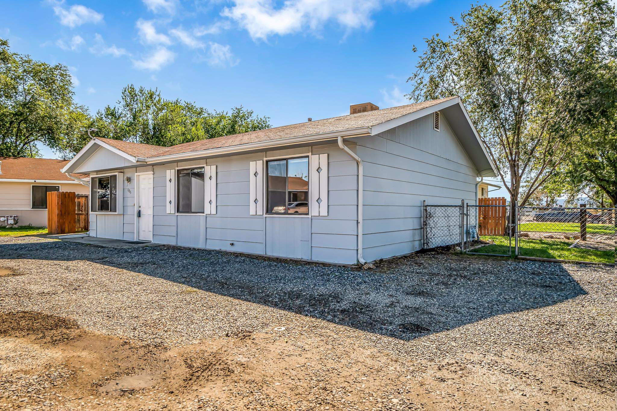 486 Harris Road Grand Junction, CO 81501 - Photo 15 of 15 a view of a house with a yard