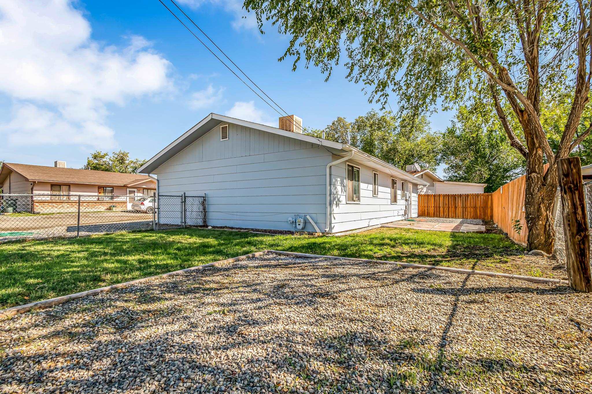 486 Harris Road Grand Junction, CO 81501 - Photo 2 of 15 a front view of a house with garden