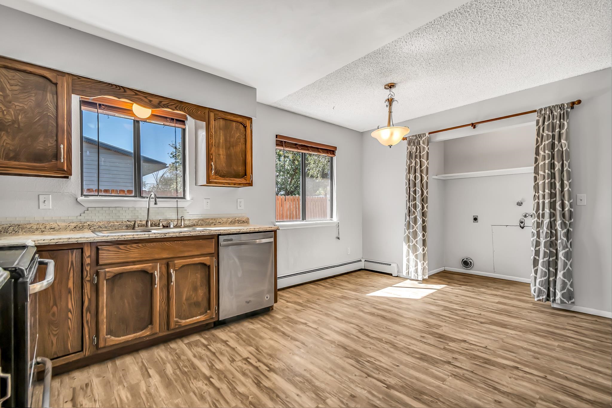 486 Harris Road Grand Junction, CO 81501 - Photo 3 of 15 a bathroom with a granite countertop sink mirror and cabinets
