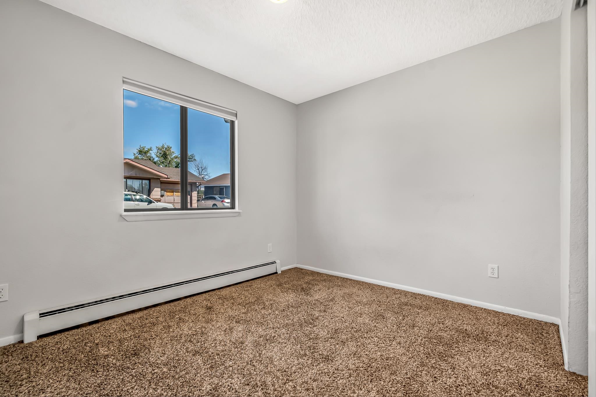 486 Harris Road Grand Junction, CO 81501 - Photo 9 of 15 a view of a small space with wooden floor and a window