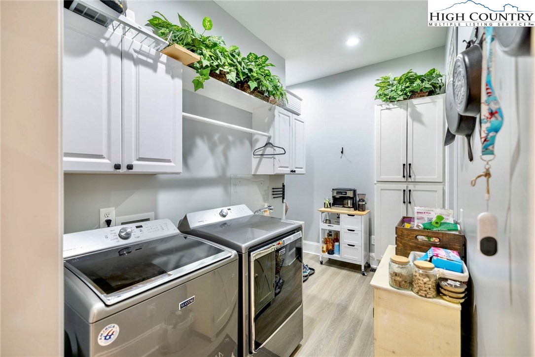 461 Chestnut Ridge Drive Jefferson, NC 28640 - Photo 20 of 47 a utility room with cabinets washer and dryer
