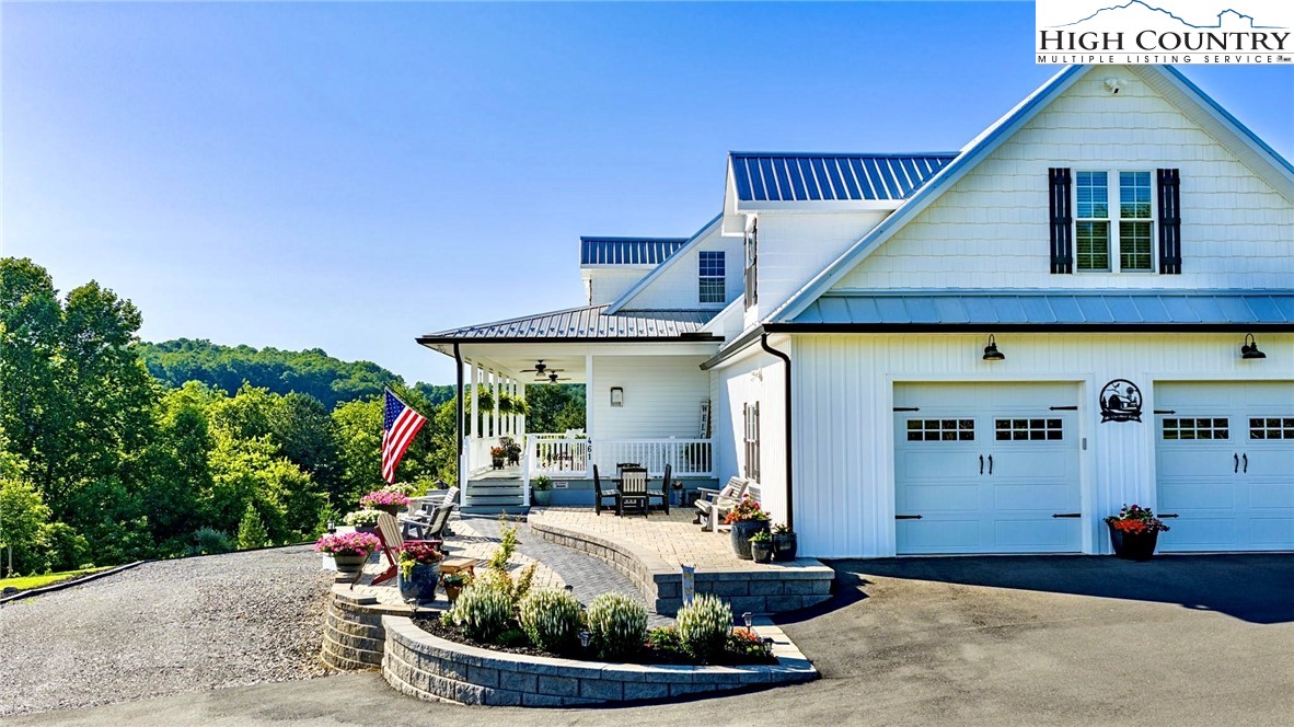 461 Chestnut Ridge Drive Jefferson, NC 28640 - Photo 43 of 47 a front view of a house with garden