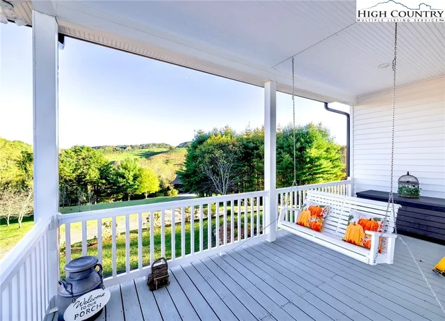 a view of a patio with a table and chairs