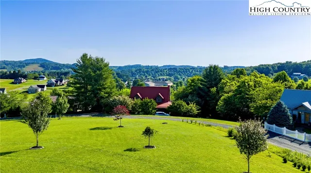 a kitchen with granite countertop a sink stainless steel appliances and cabinets