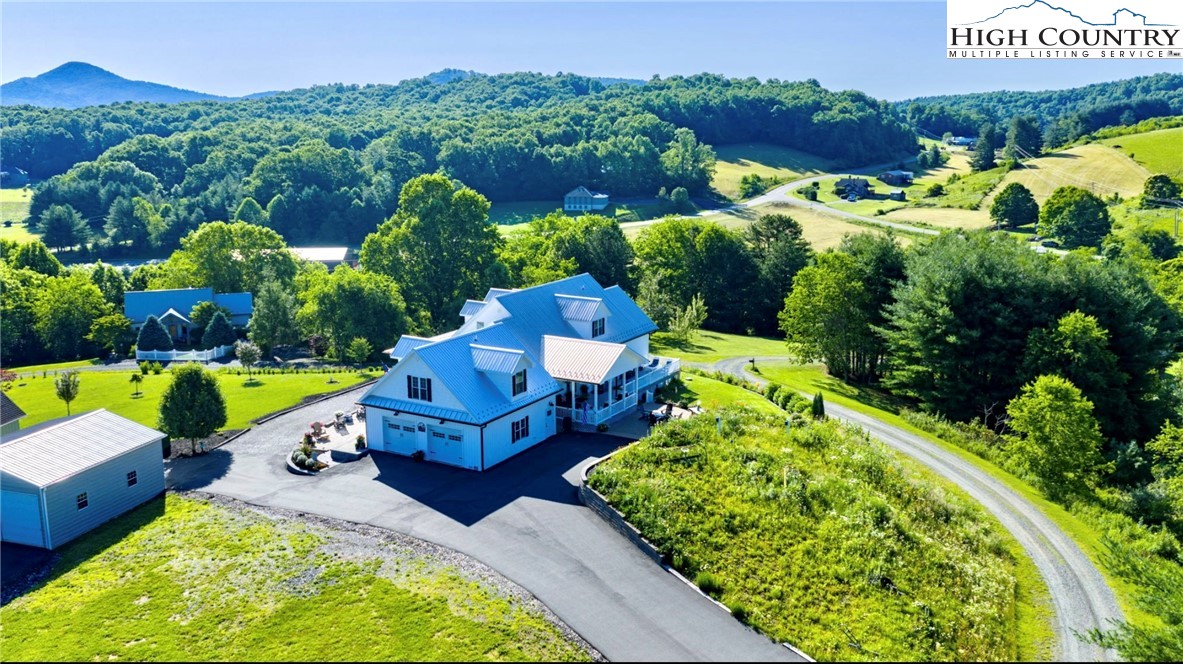 461 Chestnut Ridge Drive Jefferson, NC 28640 - Photo 7 of 47 a swimming pool with outdoor seating and yard