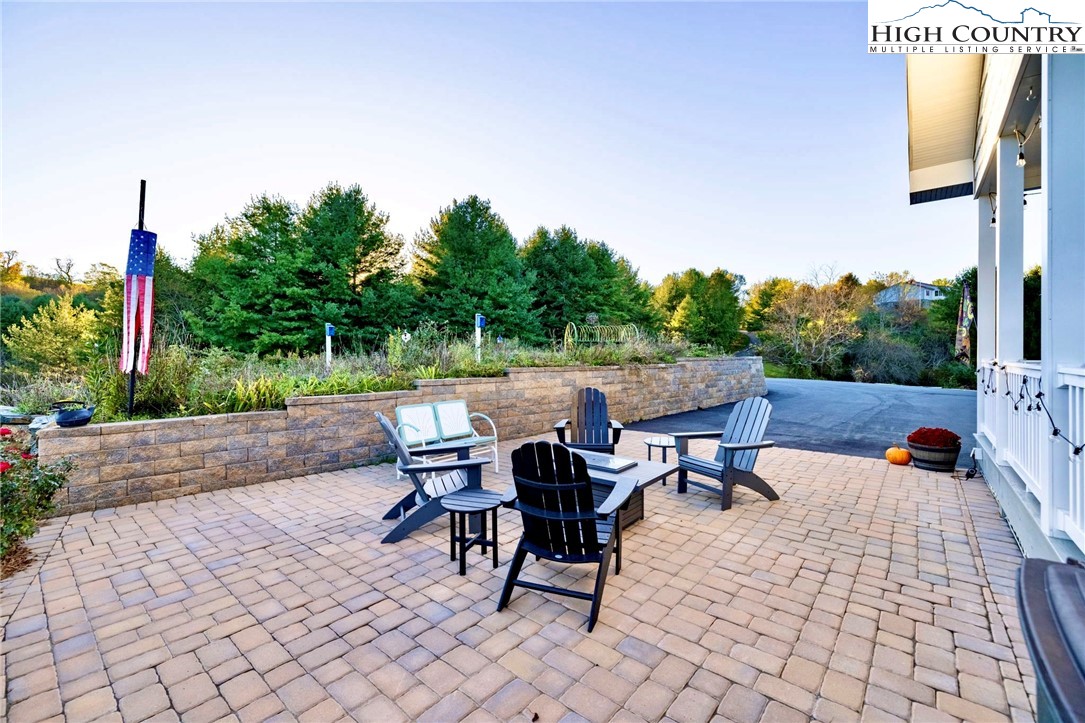 461 Chestnut Ridge Drive Jefferson, NC 28640 - Photo 9 of 47 a view of a patio with a table and chairs
