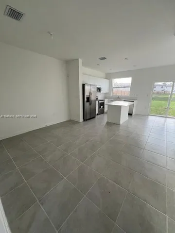 a view of a livingroom with furniture and window