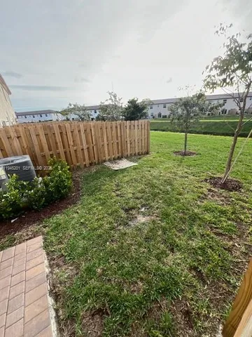 a view of an empty room and closet area