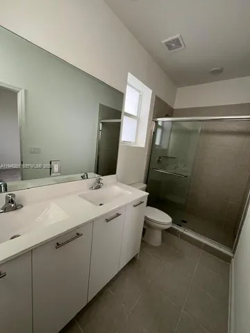 a bathroom with a toilet a sink and a bathtub