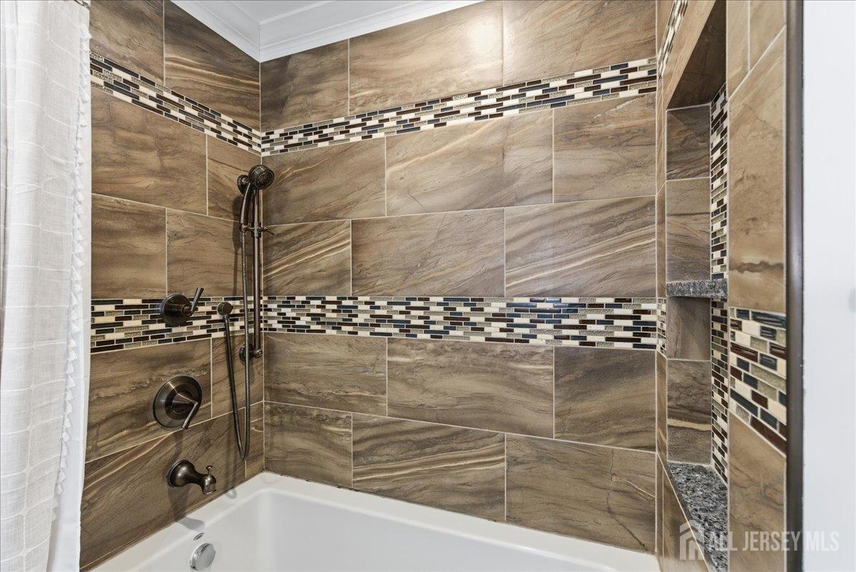 83 Garfield Avenue Colonia, NJ 07067 - Photo 18 of 45 a bathroom with a shower