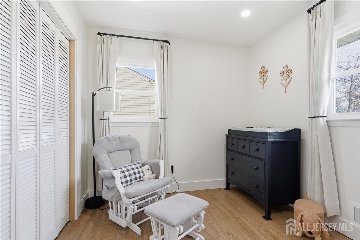 83 Garfield Avenue Colonia, NJ 07067 - Photo 20 of 45 a living room with furniture and a window